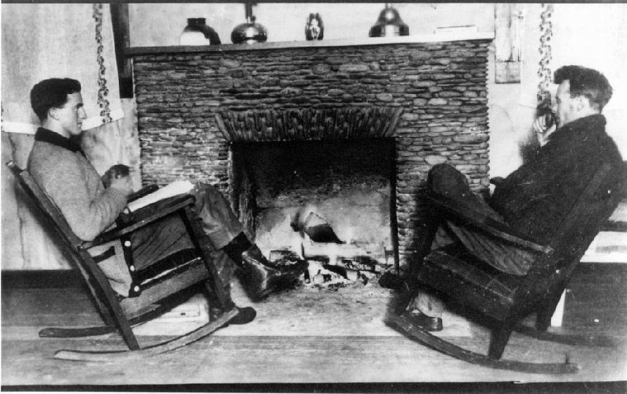 P. S. Bonney, district forester, and Walter Holliday, ranger, in a home at Mile 53. Ca. 1910