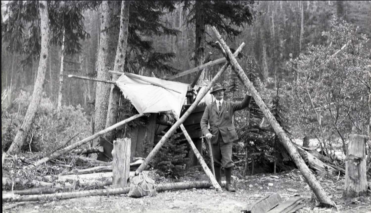 Andrew James Gilmour standing in camp with an ice axe
AAC Gilmour Collection AJG.B4A7.048