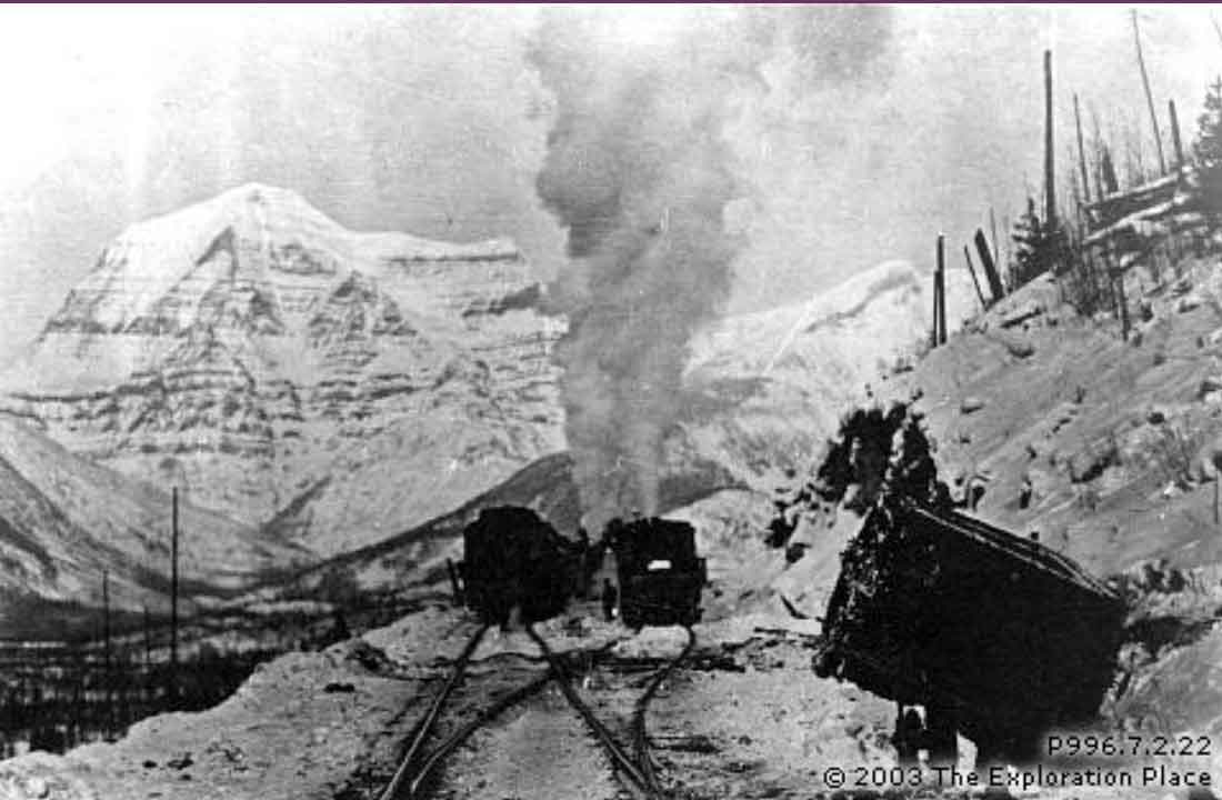 Train derailment on the main line west near Mile 13 during construction of the Grand Trunk Pacific Railway. Circa 1912.