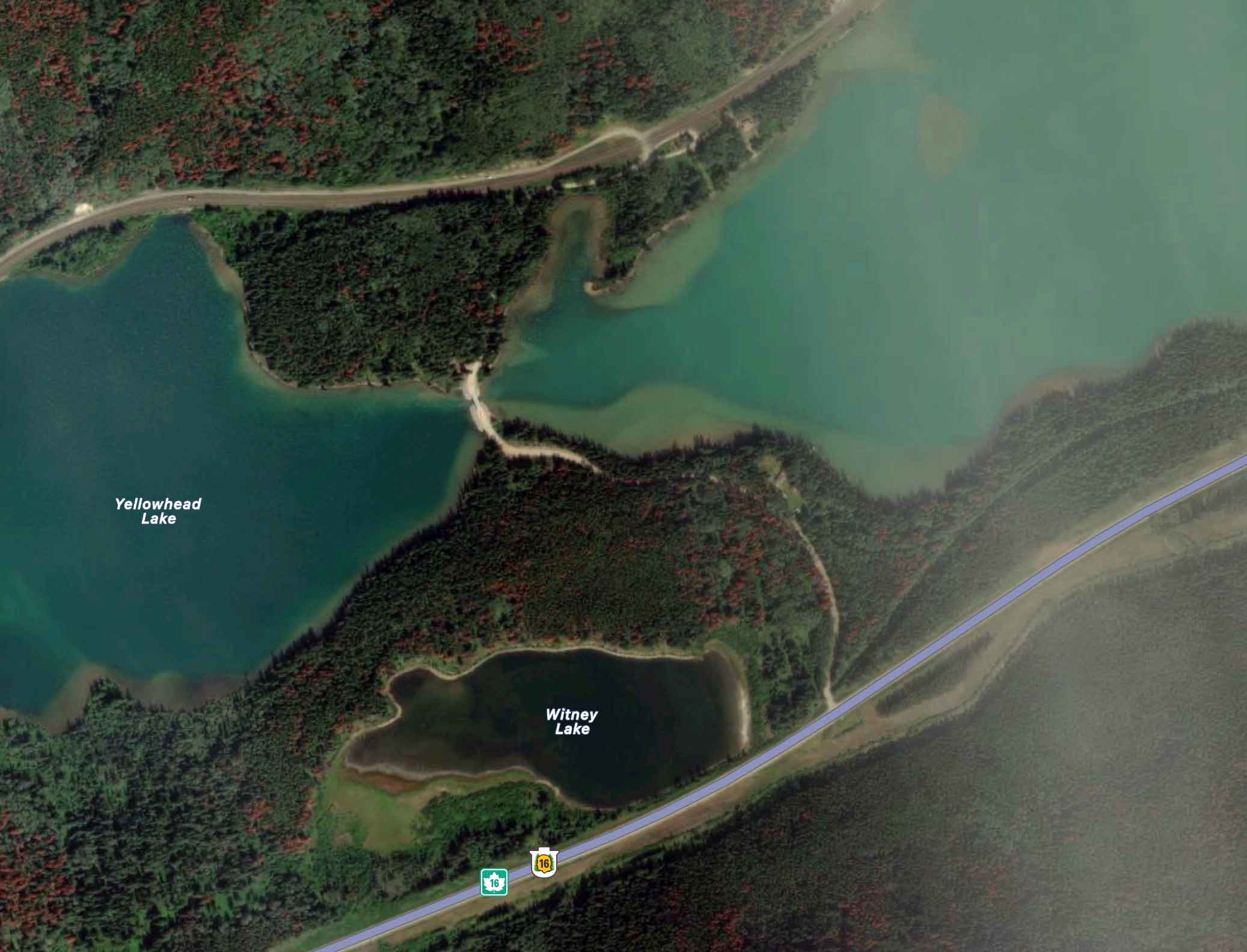 Current aerial view of Lucerne showing no structures on the south side of the lake and possible structures near the Canadian National Railway line north of the lake