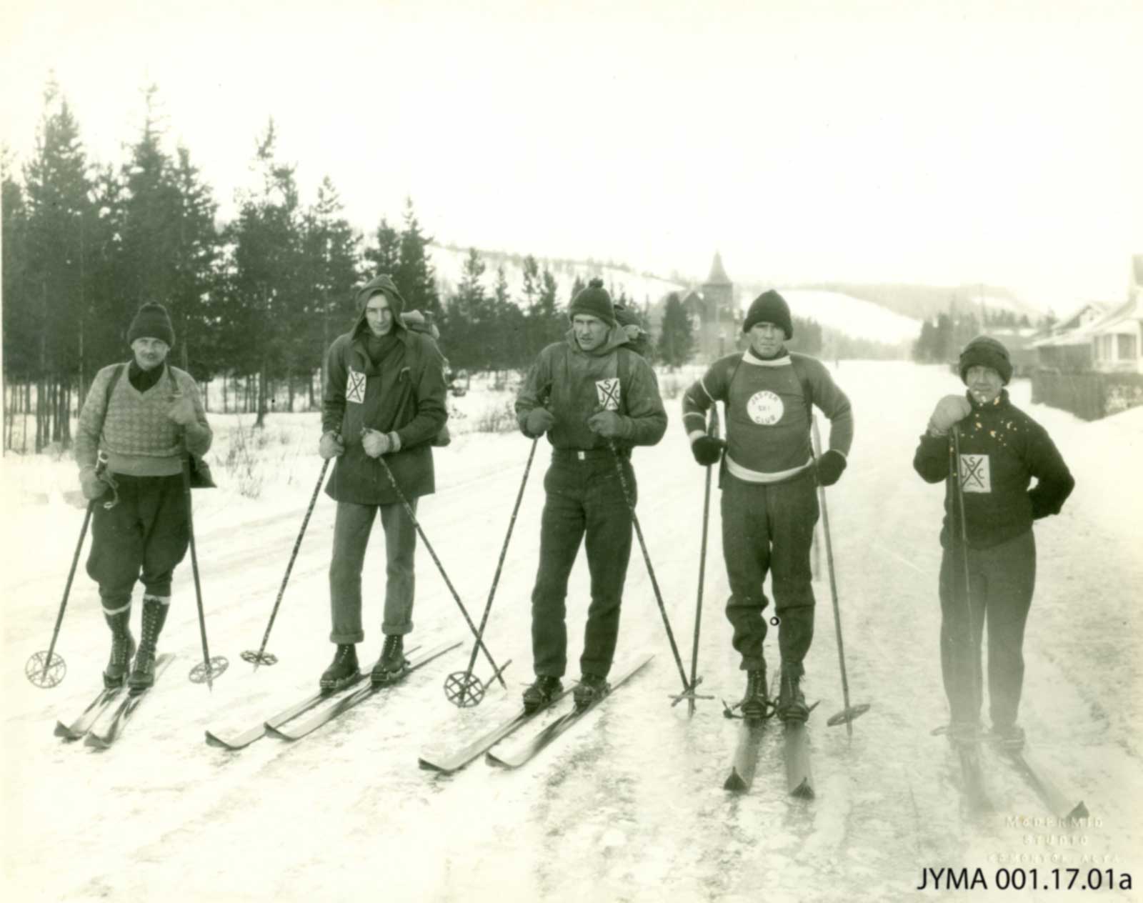 Joe Weiss, Doug Jeffery, Vern Jeffery, Frank Burstrom and Pete Withers on Geikie Street at the start of their ski trip. 1930